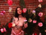Confident naked hottie shows her tattoos
